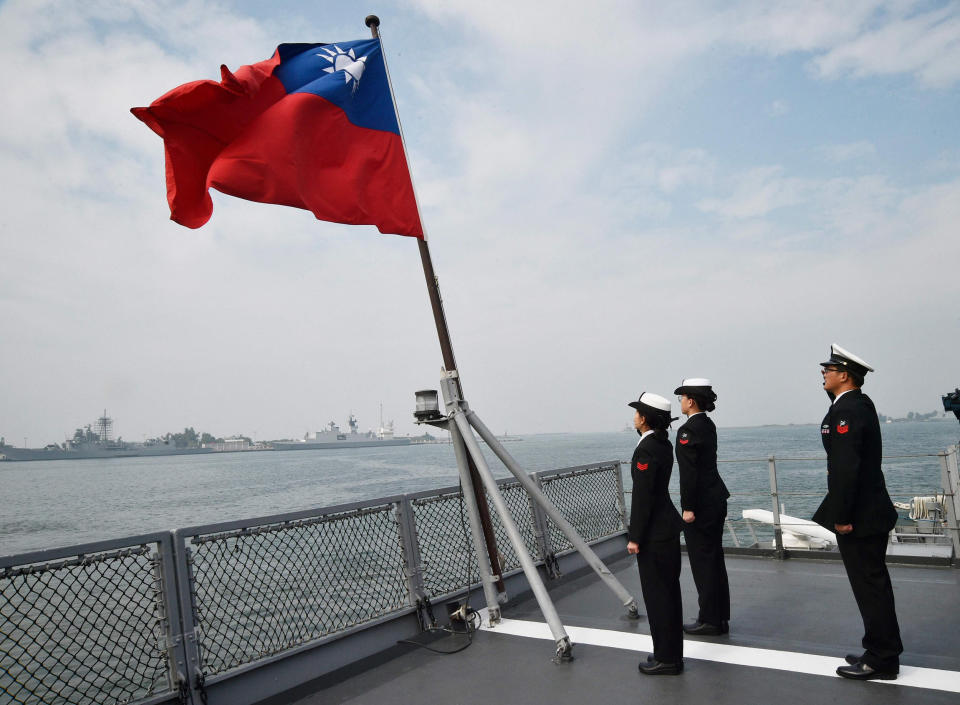 Image: Taiwanese sailors salute island's flag (Mandy Cheng / AFP - Getty Images file)