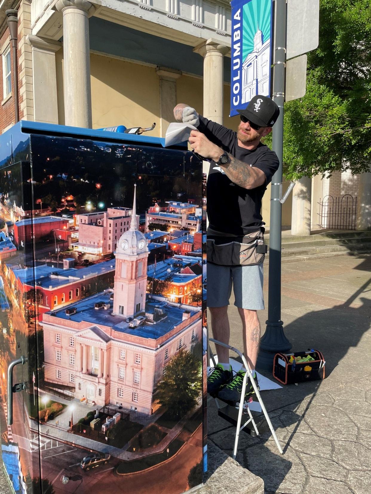 A vinyl art blanket featuring the Maury County Courthouse photographed by Ross Jaynes is installed as part of a new public arts project by the Columbia Arts Council.