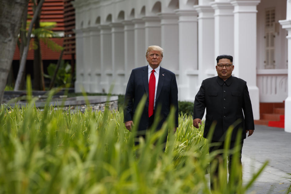 President Donald Trump walks with North Korean leader Kim Jong Un on Sentosa Island, Tuesday, June 12, 2018, in Singapore. (AP Photo/Evan Vucci)