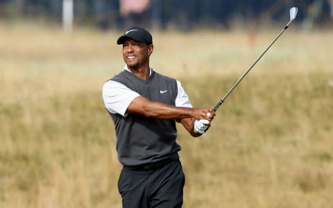Woods plays his second shot on the 17th - Woods looked like a man on a mission in his five-under round - Credit: Getty Images