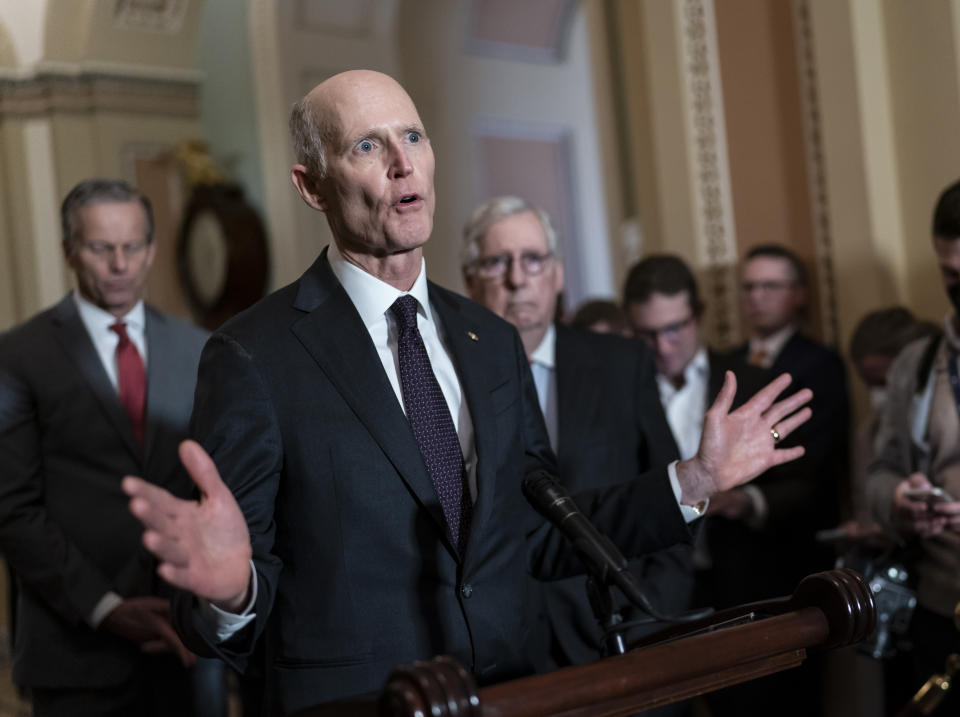 FILE — Sen. Rick Scott, R-Fla., speaks as Senate Minority Leader Mitch McConnell, R-Ky., listens at right during a news conference at the Capitol in Washington, March 8, 2022. Following the 2022 midterm elections, Scott, an ally of former President Donald Trump, is mounting a long-shot bid to unseat McConnell from his longtime position as Senate Republican leader. (AP Photo/J. Scott Applewhite, File)