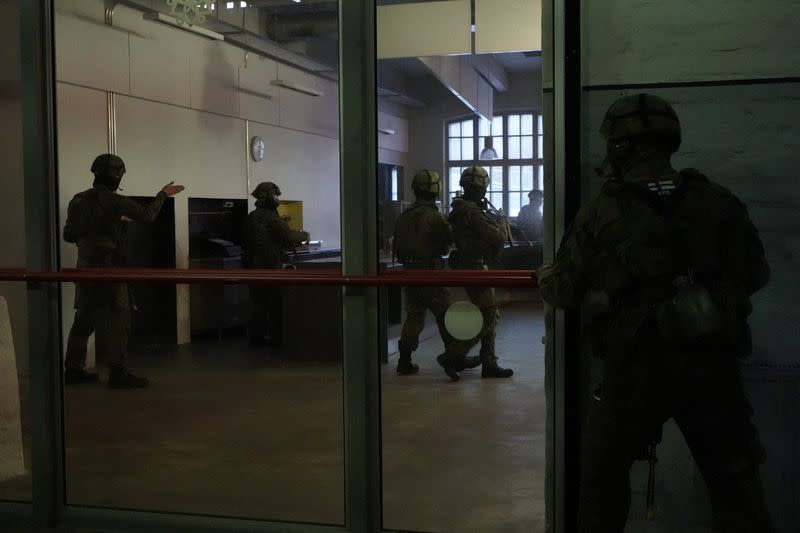 Finnish military police officers take part in a security drill in Vanhankaupunginkoski, in Helsinki