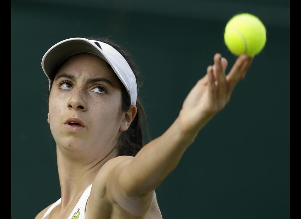 Christina McHale of the United States serves to Johanna Konta of Britain during a first round women's singles match at the All England Lawn Tennis Championships at Wimbledon, England, Monday, June 25, 2012.