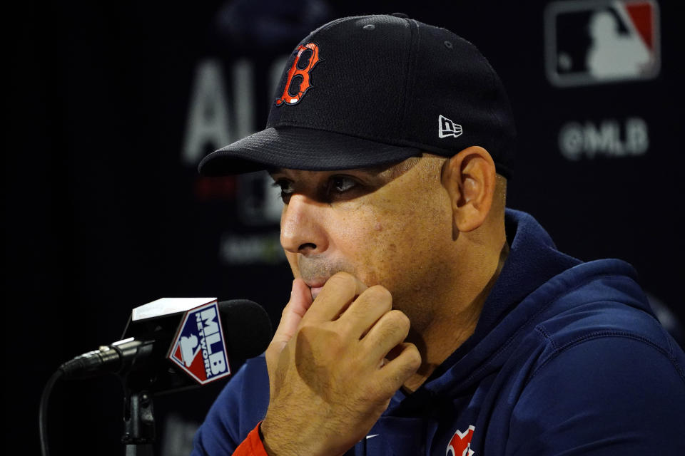 Boston Red Sox manager Alex Cora ponders a question at a news conference prior to a baseball practice at Fenway Park, Sunday, Oct. 17, 2021, in Boston. (AP Photo/Robert F. Bukaty)