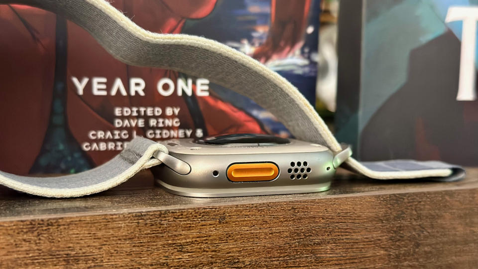 A side view of the Apple Watch Ultra 2's action button and speaker holes.