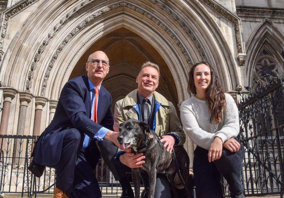 League Against Cruel Sports CEO ANDY KNOTT, naturalist and TV presenter CHRIS PACKHAM, and zoologist and TV presenter MEGAN MCCUBBIN pose for a photo with a dog in front of the Royal Courts of Justice on the second day of Packham's libel trial against the editor and two contributors of Country Squire Magazine. (Credit Image: © Vuk Valcic/ZUMA Press Wire) EDITORIAL USAGE ONLY! Not for Commercial USAGE! Credit: ZUMA Press, Inc./Alamy Live News