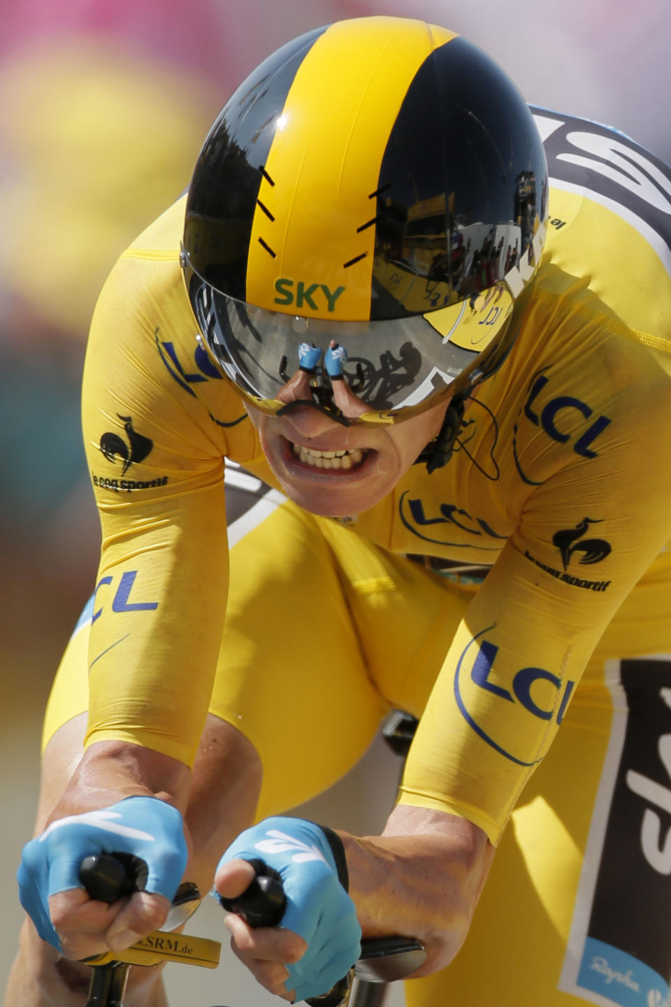 FILE - In this Wednesday, July 10, 2013 file photo, Chris Froome of Britain, wearing the overall leader's yellow jersey, strains in the last meters of the eleventh stage of the Tour de France cycling race, an individual time trial over 33 kilometers (20.6 miles) with start in in Avranches and finish in Mont-Saint-Michel, western France. Froome said Tuesday, March 4, 2014 that he wants an investigation into cycling's doping history to finally close an era dominated by Lance Armstrong. (AP Photo/Laurent Rebours, File)