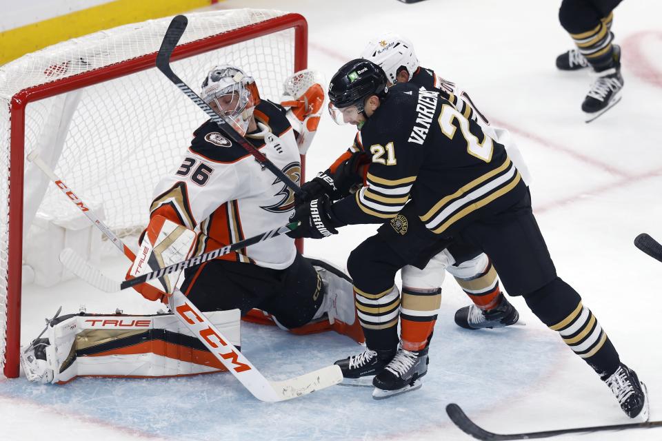 Anaheim Ducks' Cam Fowler, back right, defends against Boston Bruins' James van Riemsdyk (21) in front of Ducks goalie John Gibson (36) during the second period of an NHL hockey game, Thursday, Oct. 26, 2023, in Boston. (AP Photo/Michael Dwyer)