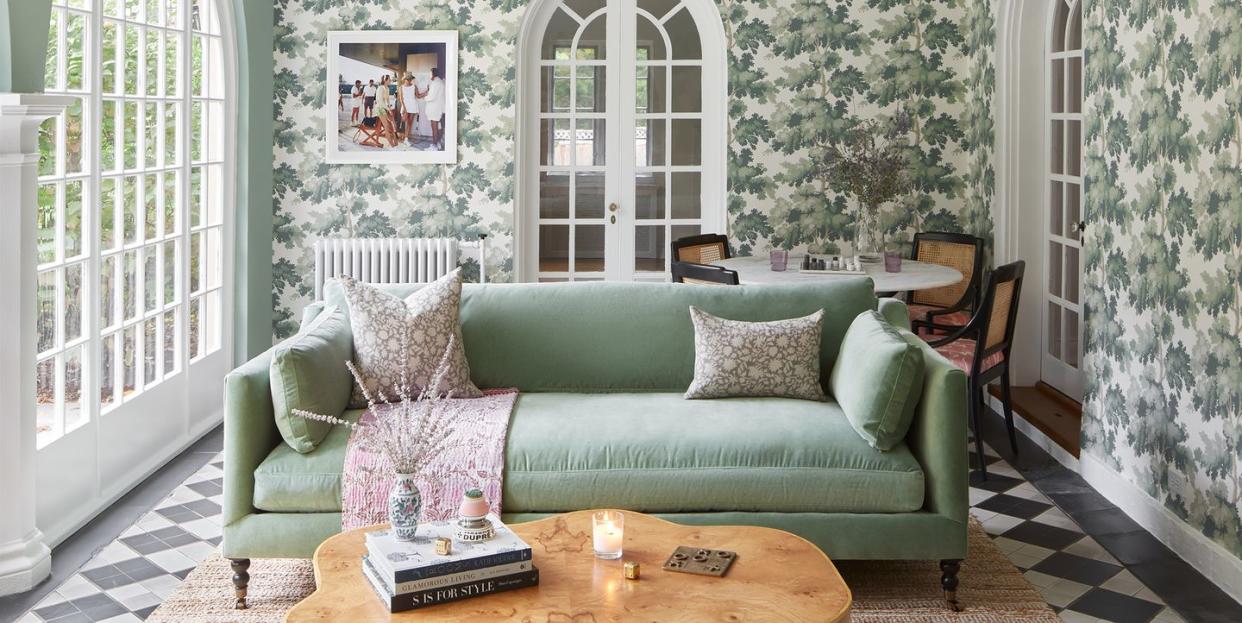 mint couch in sunroom