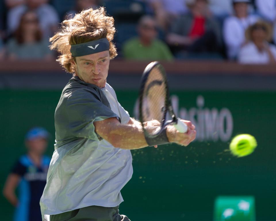 Andrey Rublev returns against Andy Murray during a BNP Paribas Open match at Indian Wells Tennis Garden in Indian Wells, California, on March 8, 2024.