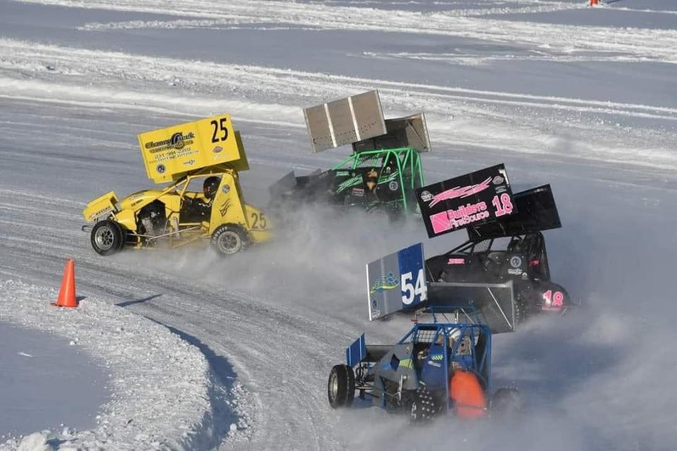 Sprint cars race on an ice track.