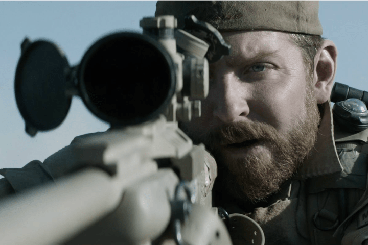 Bradley Cooper aims a gun in American Sniper.