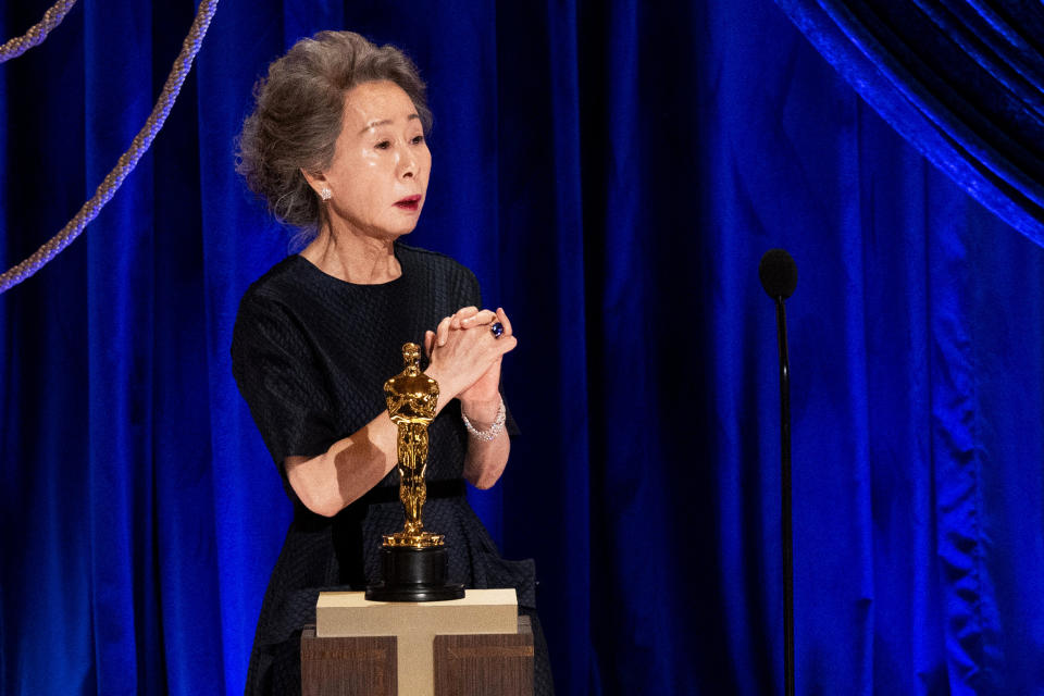 Youn Yuh-jung accepts the Oscar for best actress in a supporting role for 