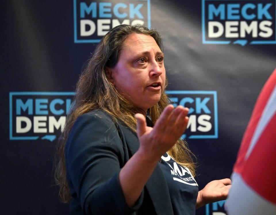 Nicole Sidman speaks with an attendee during a watch party at the Meck Dems office in Charlotte, NC on Tuesday, March 5, 2024. Sidman is running for the North Carolina House District 105 seat.
