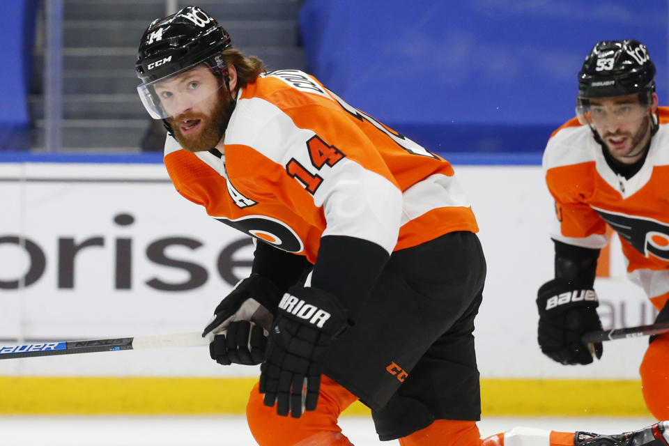 Philadelphia Flyers forward Sean Couturier (14) skates towards the net during the second period of an NHL hockey game against the Buffalo Sabres, Sunday, Feb. 28, 2021, in Buffalo, N.Y. (AP Photo/Jeffrey T. Barnes)