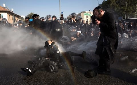 Israeli police use water cannon to disperse Ultra-Orthodox Jewish demonstrators - Credit: EPA