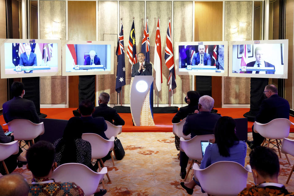 In this photo provided by Malaysia Defense Ministry, Malaysian Defense Minister Hishammuddin Hussein speaks during a press conference after the Five Powers Defense Arrangements (FPDA) meeting in Kuala Lumpur, Malaysia, Thursday, Oct. 21, 2021. The FPDA, which involves Commonwealth members Malaysia, Singapore, Australia, New Zealand and the U.K., is a non-binding treaty formed half a century ago. The countries are to consult each other in the event of armed threats or attacks on former British colonies Malaysia and Singapore. (Malaysia Defense Ministry via AP)