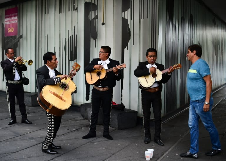 Mariachis sing songs of the late Mexican singer Juan Gabriel in the Plaza Garibaldi in Mexico City, on August 29, 2016