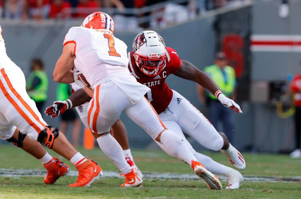 N.C. State linebacker Isaiah Moore (1) tackles Clemson running back Will Shipley (1) during the first half of N.C. State’s game against Clemson at Carter-Finley Stadium in Raleigh, N.C., Saturday, Sept. 25, 2021.