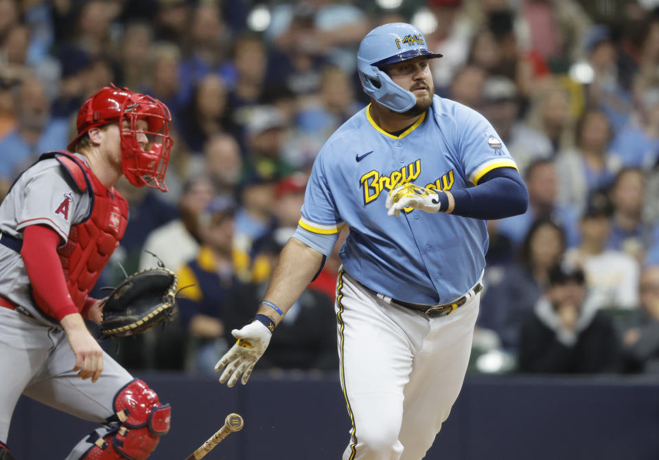 Milwaukee Brewers' Rowdy Tellez, right, hits an RBI-single against the Los Angeles Angels during the eighth inning of a baseball game Friday, April 28, 2023, in Milwaukee. (AP Photo/Jeffrey Phelps)