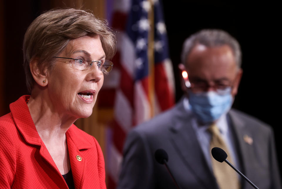 U.S. Senator Elizabeth Warren (D-MA) speaks to reporters with Senate Majority Leader Chuck Schumer (D-NY)  during a news conference on Democrats' demand for an extension of eviction protections in the next coronavirus disease (COVID-19) aid bill on Capitol Hill in Washington, U.S., July 22, 2020. REUTERS/Jonathan Ernst