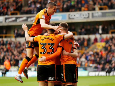 Soccer Football - Championship - Wolverhampton Wanderers vs Birmingham City - Molineux Stadium, Wolverhampton, Britain - April 15, 2018 Wolverhampton Wanderers' Diogo Jota celebrates scoring their first goal with team mates Action Images via Reuters/Andrew Boyers