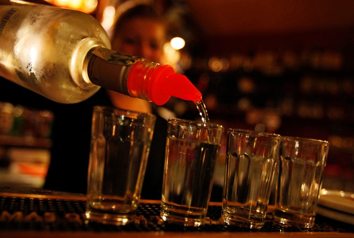 A bartender serves alcohol at a bar in Prague September 12, 2012.