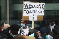 Tottenham fans stage a protest against the Board over the planned creation of a European Super League, outside the Tottenham Hotspur Stadium ahead of the English Premier League football match between Tottenham Hotspur and Southampton in London, England, Wednesday April 21, 2021. (Clive Rose/Pool via AP)