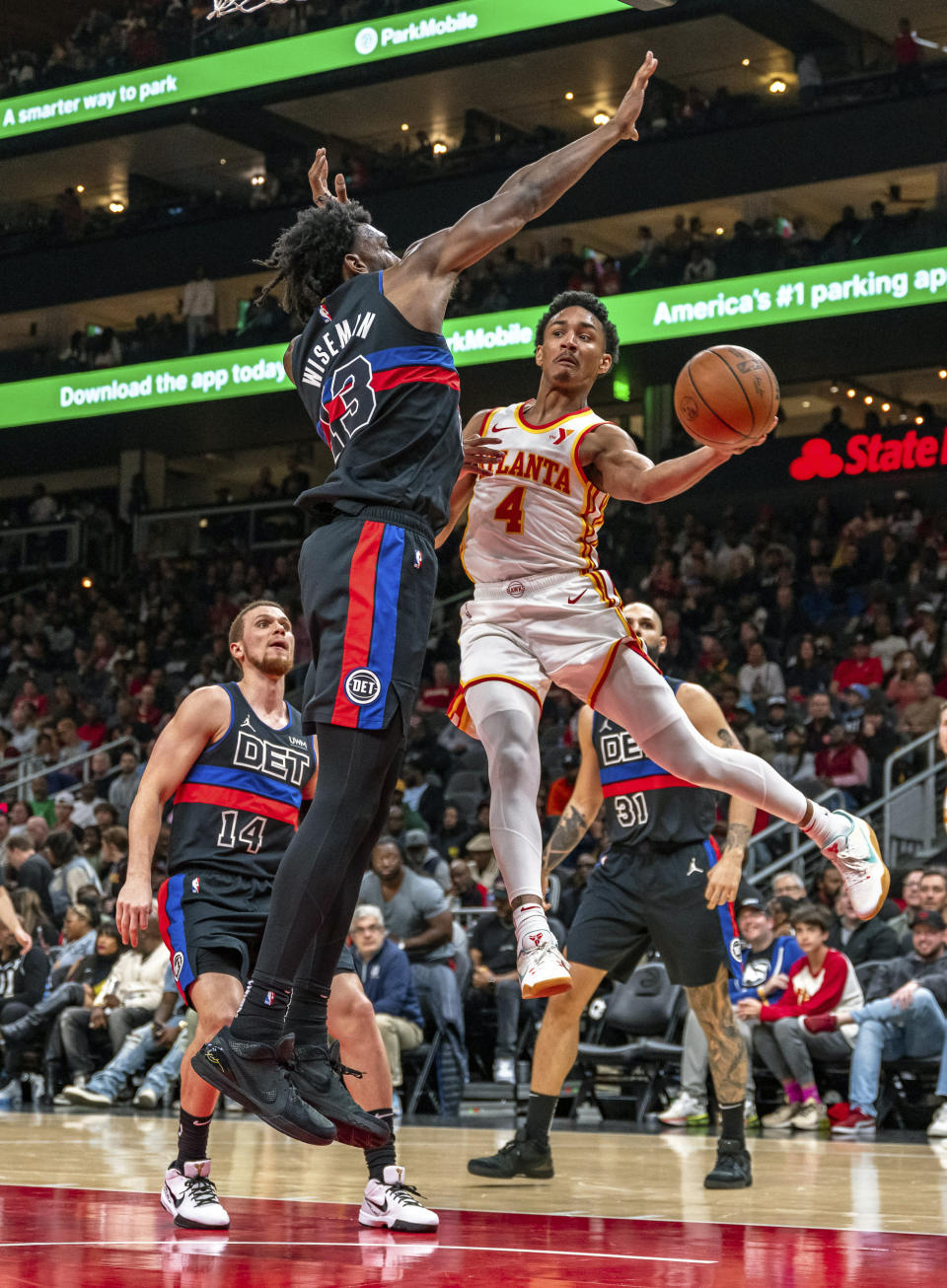 Atlanta Hawks guard Kobe Bufkin (4) passes the ball during the second half of an NBA basketball game against the Detroit Pistons, Wednesday, April 3, 2024, in Atlanta. (AP Photo/Jason Allen)