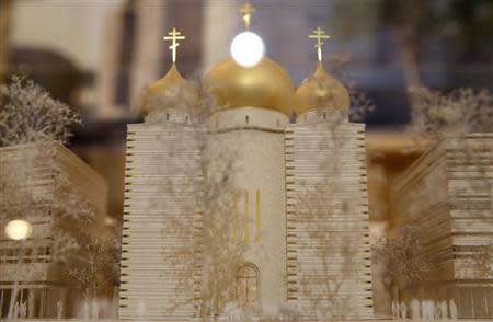 A model of a Russian Orthodox church and spiritual centre, to be built along the Seine River near the Eiffel Tower, is seen during a media presentation at the Russian ambassador's residence in Paris, January 17, 2014. REUTERS/Christian Hartmann