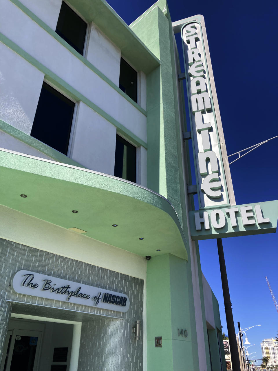 The exterior of the Streamline Hotel is seen in Daytona Beach, Fla., on Friday, Jan 27, 2023. The Streamline Hotel, which opened in 1941 and was recognized as the birthplace of NASCAR because of its history of hosting meetings between drivers and officials, has once again become an icon near the famous beach. (AP Photo/Mark Long)