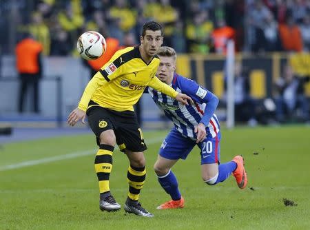 Football Soccer - Hertha Berlin v Borussia Dortmund - German Bundesliga - Olympiastadion, Berlin, Germany - 06/02/16 Borussia Dortmund's Henrikh Mkhitaryan and Hertha Berlin's Mitchell Weiser in action REUTERS/Fabrizio Bensch