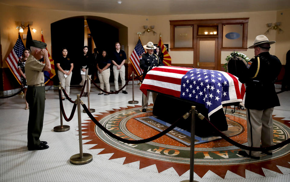 Former U.S. Marine Jose Cordero Torres, 82, a Vietnam War veteran salutes near the casket during a memorial service for Sen. John McCain, R-Ariz. at the Arizona Capitol on Wednesday, Aug. 29, 2018, in Phoenix. (AP Photo/Jae C. Hong, Pool)