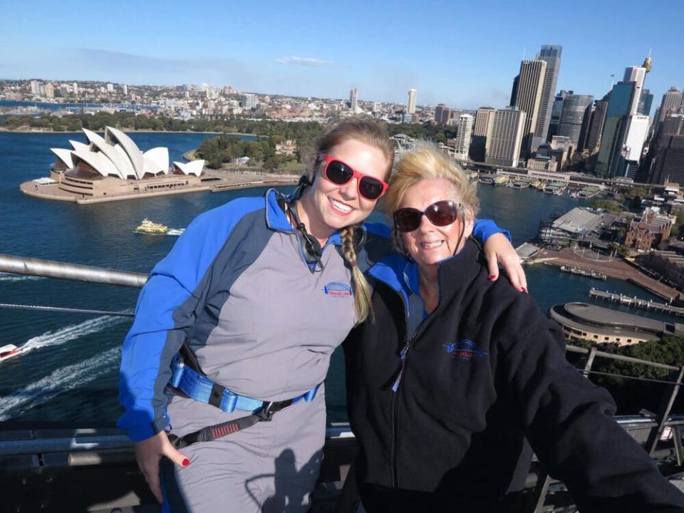 At the top of the Sydney Harbor Bridge Climb with her mom, Chris Woods: 