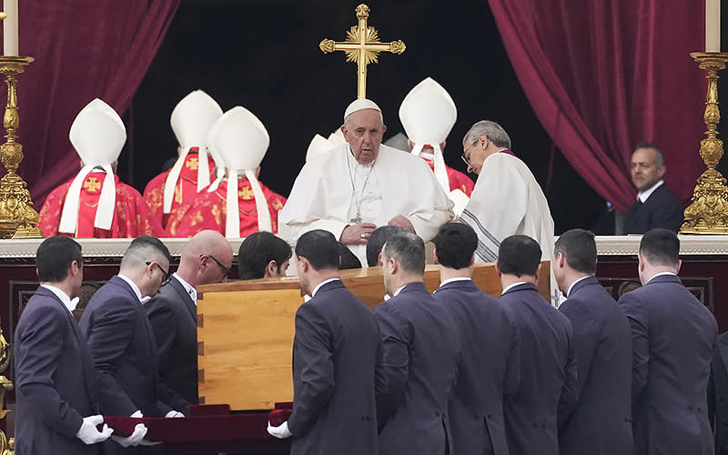 Pope Francis sits as the coffin of late Pope Emeritus Benedict XVI is carried through St. Peter’s Square for a funeral mass at the Vatican on Jan. 5. <em>Associated Press/Alessandra Tarantino</em>