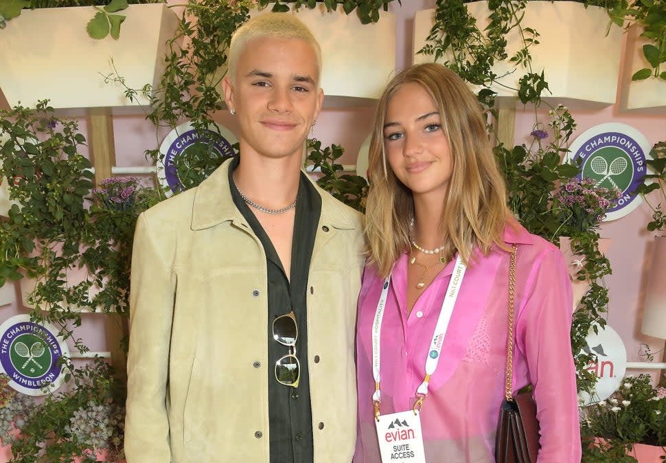 Romeo Beckham and Mia Regan pose in evian's VIP suite, certified as carbon neutral by The Carbon Trust, during day one of The Championships, Wimbledon 2021 on June 28, 2021 in London, England