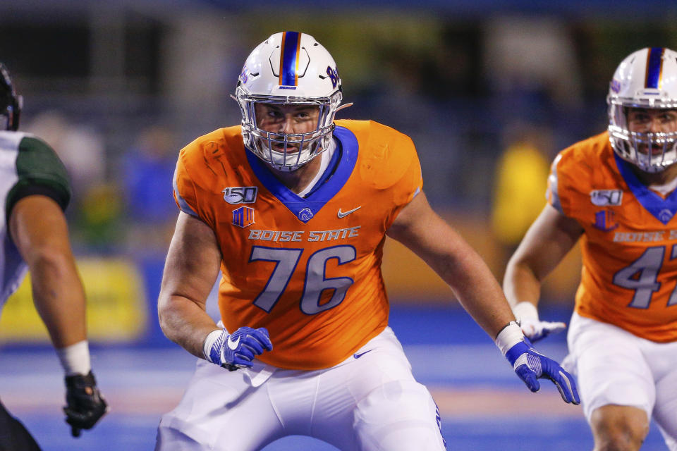 FILE - In this Oct. 12, 2019, file photo, Boise State offensive lineman Ezra Cleveland (76) is shown during the first half of an NCAA college football game against Hawaii in Boise, Idaho. Cleveland is a possible pick in the NFL Draft which runs Thursday, April 23, 2020, thru Saturday, April 25. (AP Photo/Steve Conner, File)