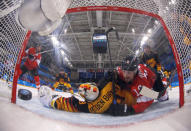 Ice Hockey - Pyeongchang 2018 Winter Olympics - Men's Playoff Match - Switzerland v Germany - Gangneung Hockey Centre, Gangneung, South Korea - February 20, 2018 - Simon Moser of Switzerland scores a goal against goalie Danny aus den Birken of Germany, as Andres Ambuhl of Switzerland looks on. REUTERS/Brian Snyder