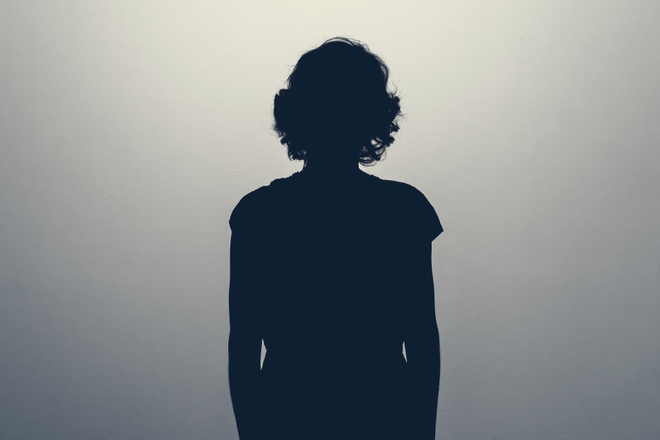 Unknown female person silhouette in studio. Concept of depression, stress or anonymous