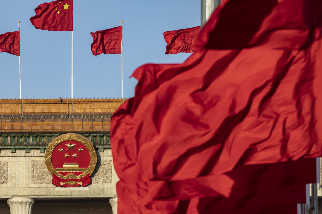 Chinese national flags fly over Tiananmen Square along with other red flags ahead of the fifth plenary session of the First Session of the 14th National People's Congress (NPC) at the Great Hall of the People in Beijing, China, on Sunday, March 12, 2023. (Photographer: Qilai Shen/Bloomberg)