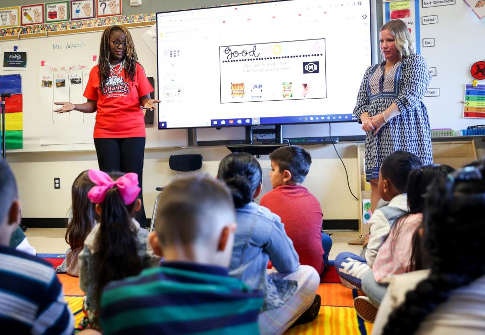 Charlene Williams, left, director of Oregon Department of Education, visits with students on the first day of school at Chávez Elementary School in Salem.
