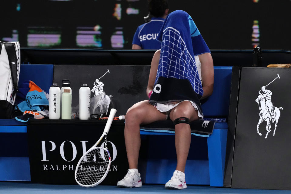Iga Swiatek of Poland reacts during a break in her second round match against Danielle Collins of the U.S. at the Australian Open tennis championships at Melbourne Park, Melbourne, Australia, Thursday, Jan. 18, 2024. (AP Photo/Andy Wong)