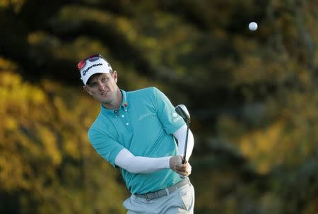 Justin Rose of England chips onto the 18th green in second round play during the 2017 Masters golf tournament at Augusta National Golf Club in Augusta, Georgia, U.S., April 7, 2017. REUTERS/Brian Snyder