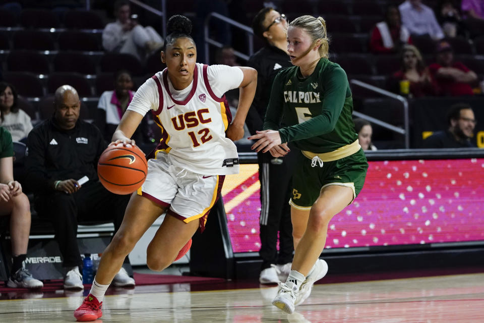 Southern California guard JuJu Watkins (12) drives against Cal Poly guard Ania McNicholas during the first half of an NCAA college basketball game, Tuesday, Nov. 28, 2023, in Los Angeles. (AP Photo/Ryan Sun)