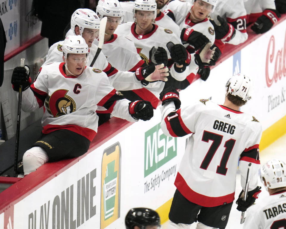 Ottawa Senators' Ridly Greig (71) returns to the bench after scoring during the first period of an NHL hockey game against the Pittsburgh Penguins in Pittsburgh, Saturday, Oct. 28, 2023. (AP Photo/Gene J. Puskar)