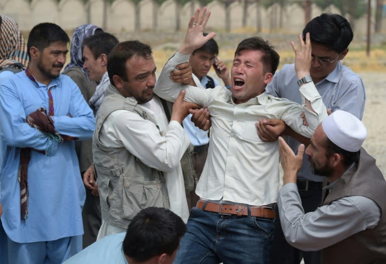 A man at a mosque in Kabul on July 24, 2016, grieves the death of a relative after the IS group claimed responsibility for twin explosions the day before that ripped through crowds of Shiite Hazaras in the Afghan capital killing at least 80 people