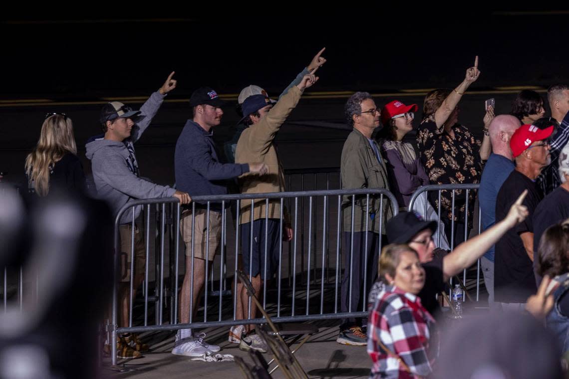 Some supporters hold up their index fingers as former president Donald Trump speaks during a rally at Wilmington International Airport Friday, Sept. 23, 2023.