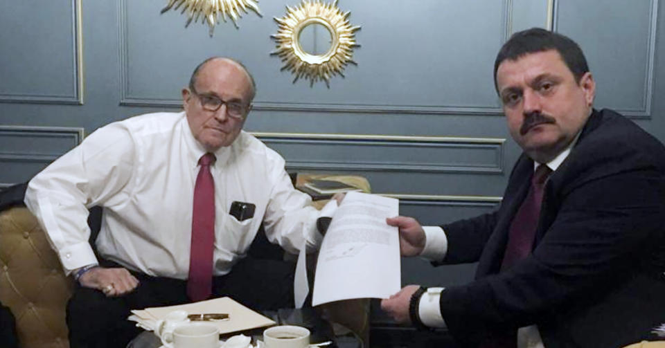 In this handout photo provided by Adriii Derkach's press office, Rudy Giuliani, an attorney for U.S President Donald Trump, left, meets with Ukrainian lawmaker Adriii Derkach in Kyiv, Ukraine, Thursday, Dec. 5, 2019. A Ukrainian lawmaker says he has met up with Rudy Giuliani, President Donald Trump’s personal attorney, in Kyiv to discuss an anti-corruption project. Derkach, who has previously accused the son of former Vice President Joe Biden of embezzling money from a gas company in Ukraine, posted photos of Thursday’s meeting on his Facebook page. (Adriii Derkach's press office via AP)