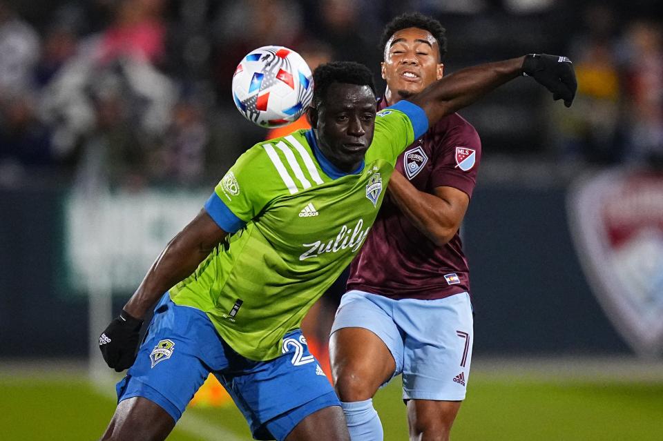 Seattle Sounders defender Yeimar Gomez (28) blocks out Colorado Rapids forward Jonathan Lewis (7) during Wednesday night's game at Dick's Sporting Goods Park.