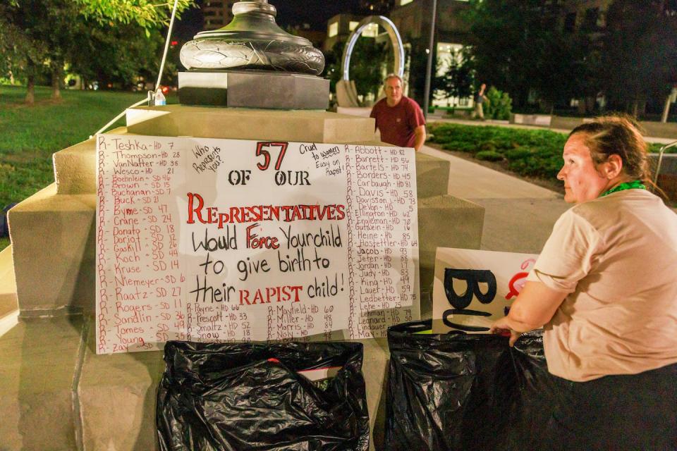 A sign lists the names of the 57 Indiana House of Representatives members who voted to ban abortion during a special session in June, 2022. <a href="https://www.gettyimages.com/detail/news-photo/sign-lists-the-names-of-the-57-indiana-house-of-news-photo/1242343395?adppopup=true" rel="nofollow noopener" target="_blank" data-ylk="slk:Jeremy Hogan/SOPA Images/LightRocket via Getty Images;elm:context_link;itc:0;sec:content-canvas" class="link ">Jeremy Hogan/SOPA Images/LightRocket via Getty Images</a>